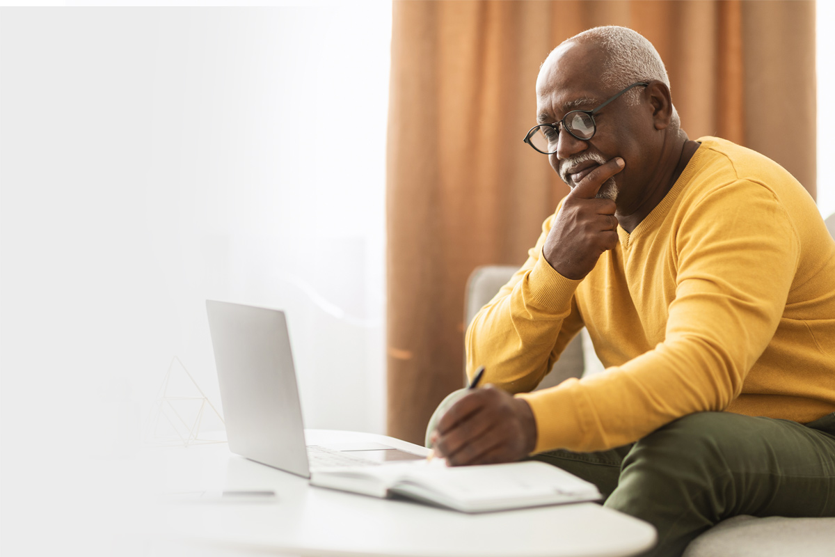 A man looking at a computer